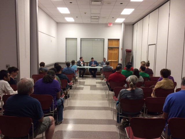More than 50 people attended the Aug. 15, 2017, panel discussion on Arkansas' new law allowing concealed weapons to be carried on campuses statewide. The session was held at St. Paul's Episcopal Church in Fayetteville and featured officials of the University of Arkansas.