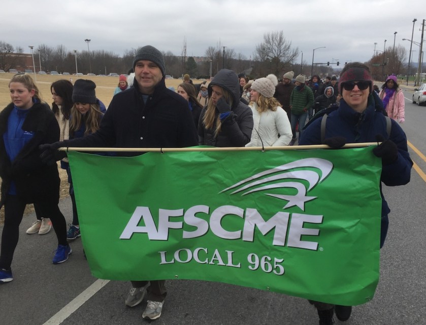 Mike Pierce and Tricia Starks represent AFSCME Local 965 at Fayetteville's Martin Luther King Jr. march Jan. 15, 2018.