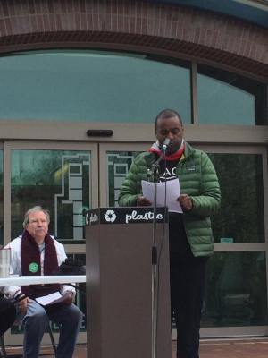 Walter Hinojosa listens as D'Andre Jones speaks April 7, 2018, at the University of Arkansas Living Wage Rally at the Fayetteville Town Center Plaza. Hinojosa is president of the Northwest Arkansas Joint Labor Council, AFL-CIO. Jones is a member of the Northwest Arkansas MLK Council, chair of the Fayetteville Civil Rights Commission. Photo Bret Schulte