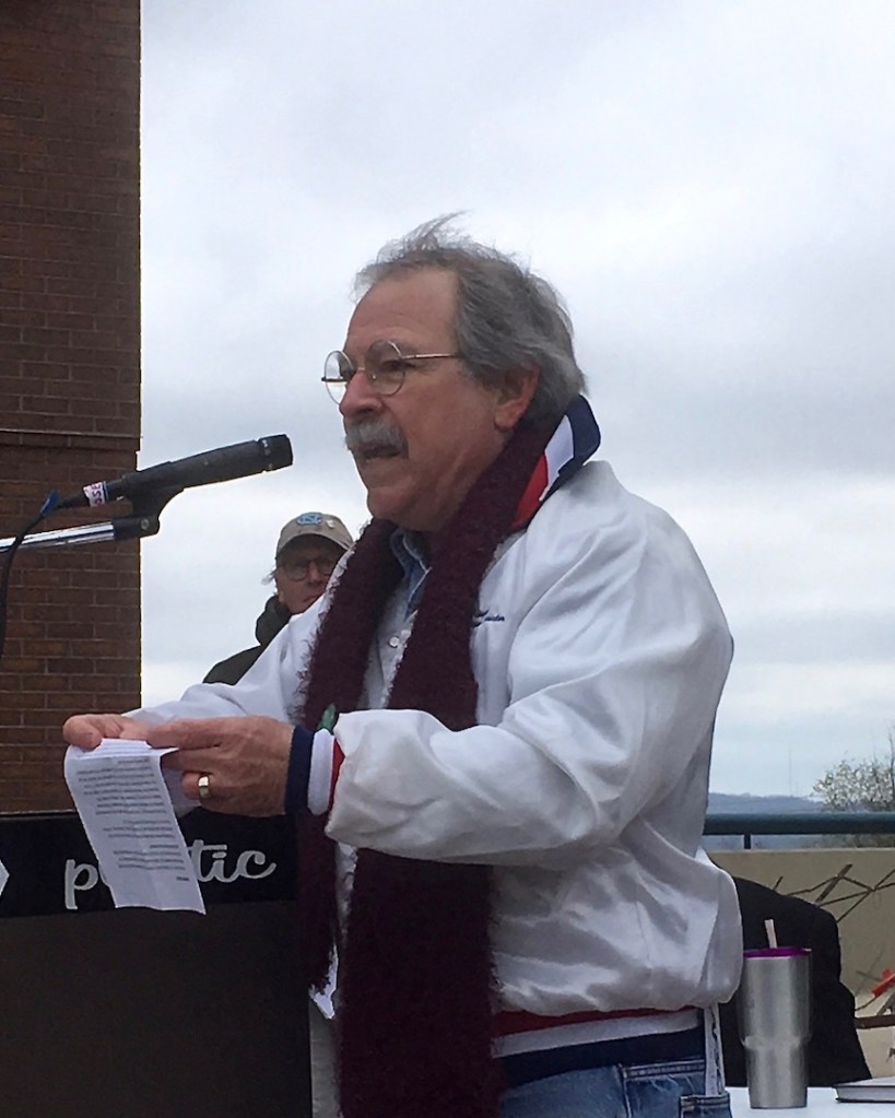 Walter Hinojosa, president of Northwest Arkansas Joint Labor Council, AFL-CIO, focuses on the history of fair wages at the U of A Living Wage Rally on April 7, 2018, on the Fayetteville Town Center plaza. Photo Ben Pollock