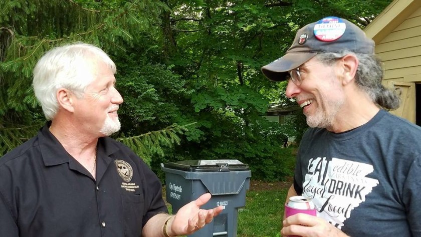 Alan Hughes (left) chews the fat May 31, 2018, with Hershey Garner at the Northwest Arkansas Labor Council annual barbecue, at Martin Law Firm in Fayetteville. Hughes is president of Arkansas AFL-CIO. Garner is the husband of Denise Garner, Democratic nominee for District 84 of the Arkansas House of Representatives.