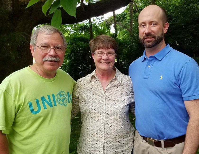 Walter Hinojosa (from left) Betty Martin and her son Aaron Martin enjoy the Northwest Arkansas Labor Council annual barbecue, at Martin Law Firm in Fayetteville, May 31, 2018. Hinojosa is president of the Northwest Arkanss Joint Labor Council. Betty Martin is a trustee and past president of Local 965 of the American Federation of State, County and Municipal Employees. Aaron Martin, an attorney, is a member of the Office and Professional Employees International Union.