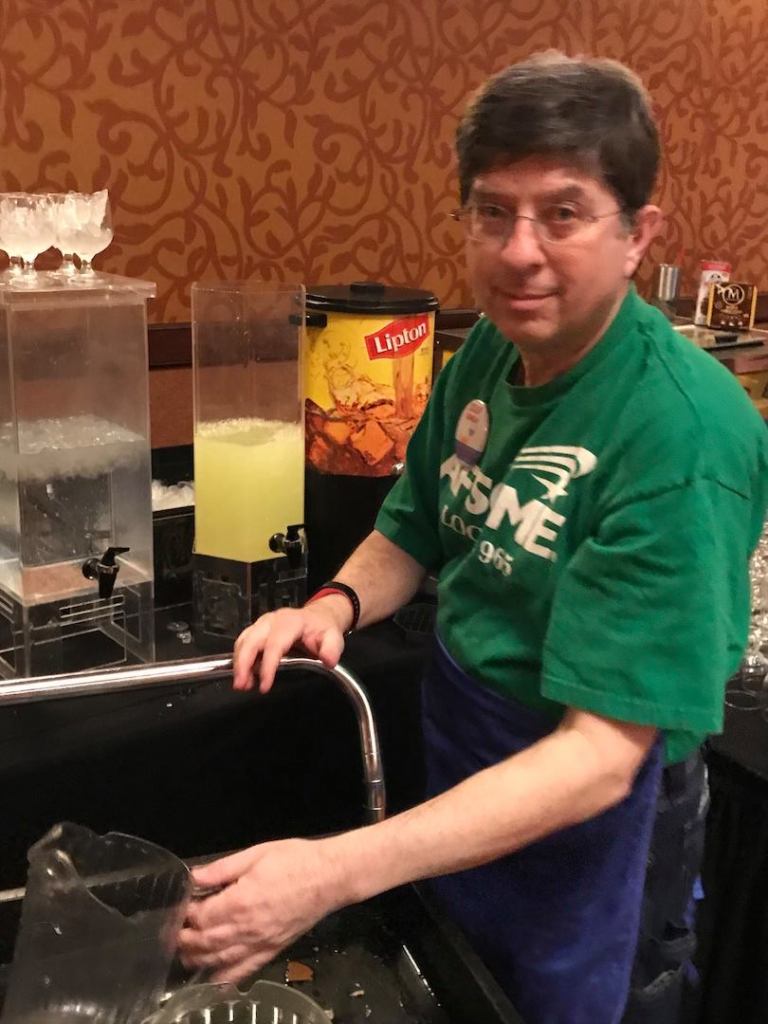 Local member Ben Pollock helped at the beverage tables of the 2019 Soup Sunday benefit in Rogers, Arkansas.