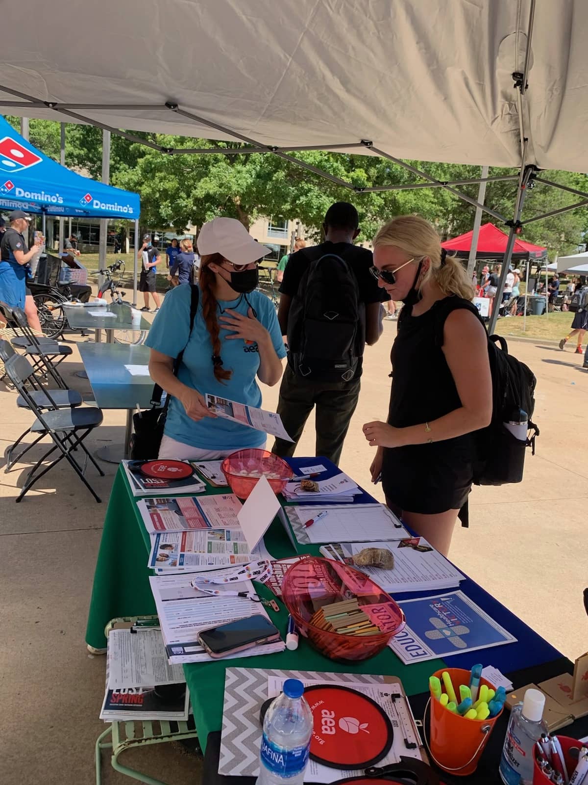 AEA UniServ Diretor Renee Johnson explains the benefits of membership to a UA student at the Razorbash fair Aug. 25, 2021.