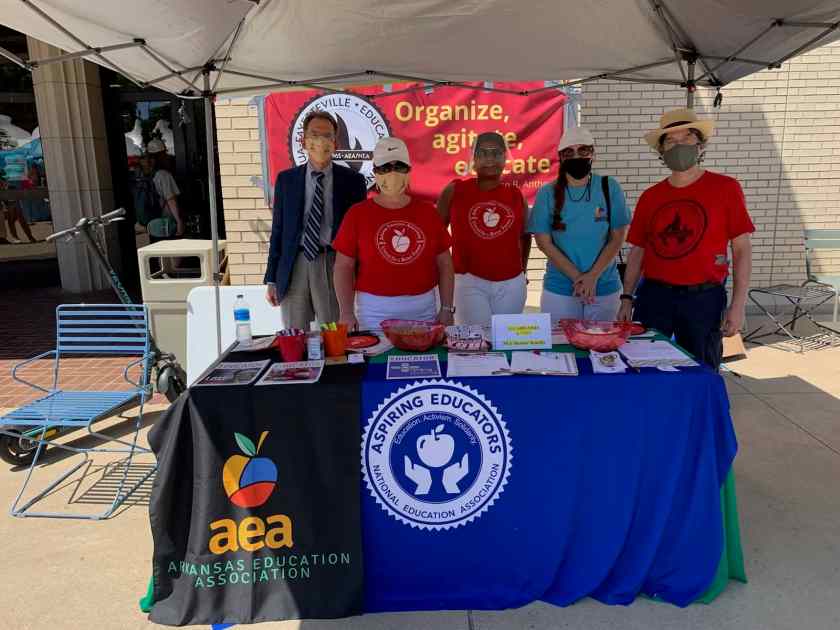 Local 965 board member Patrick Williams, with AEA's Carol Fleming, Karla Carpenter and Renee Johnson, and and 965 Secretary Ben Pollock pause between student queries at the Aug. 26, 2021, Razorbash on the Fayetteville UA campus.