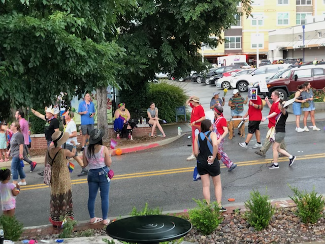 The red-shirted Mike Pierce, Ben Pollock, Ryan Gliszinski and Chad Kieffer then Trish Starks (black T-shirt) head down Dickson Street in Fayetteville's 18th annual Pride Parade.