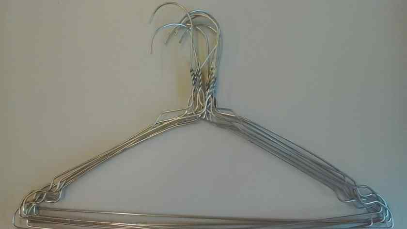 Stack of wire clothes hangers.