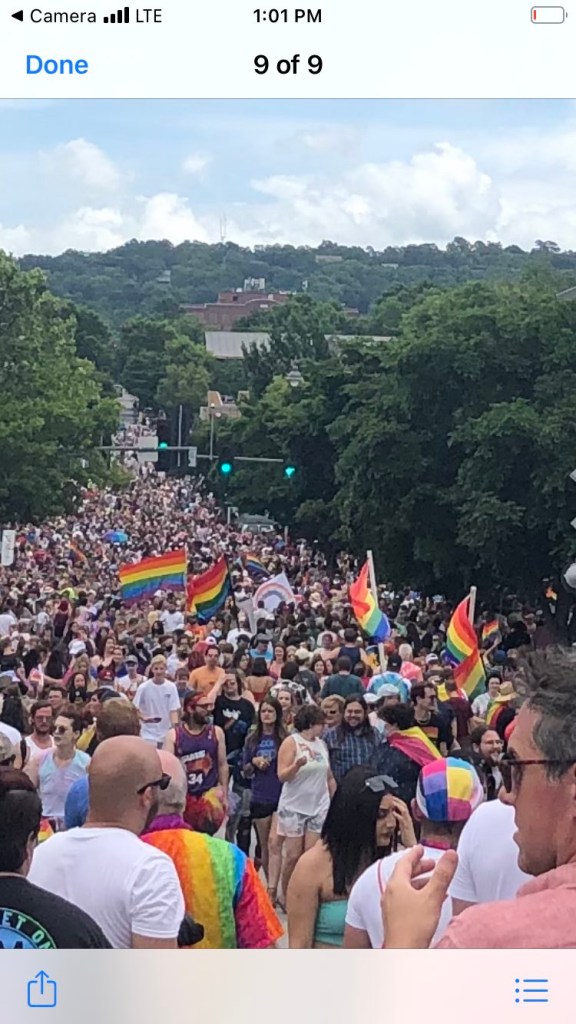 As the 2022 Fayetteville Pride Parade ends June 18, thousands of bystanders flow onto Dickson Street from its sidewalks.