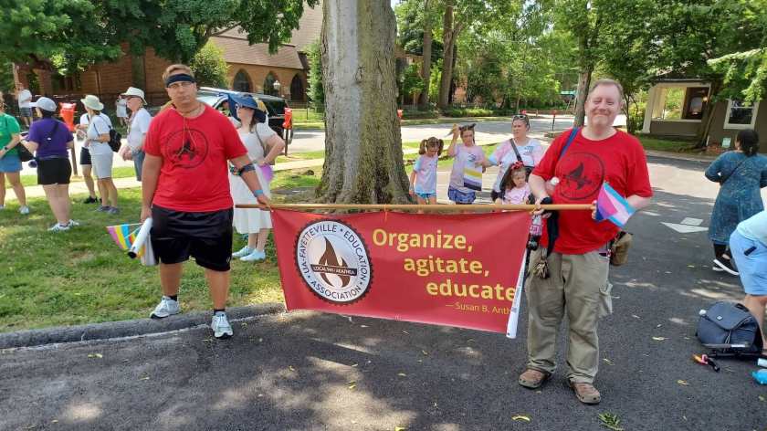 A friend of the union and Chad Kieffer join the line-up for the 2nd annual Fayetteville Trans March June 18, 2020. They're representing UA-Fayetteville Education Association/Local 965.