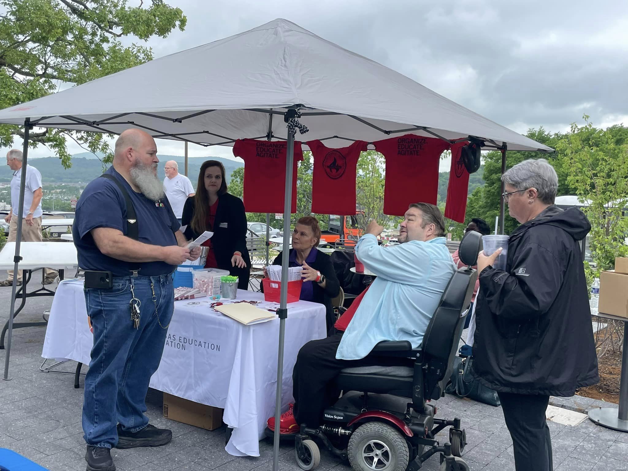 Local 965 President Hershel Hartford talks with a University of Arkansas employee at the May 17, 2023, University of Arkansas Staff Appreciation Picnic at the 1021 Food Hall.