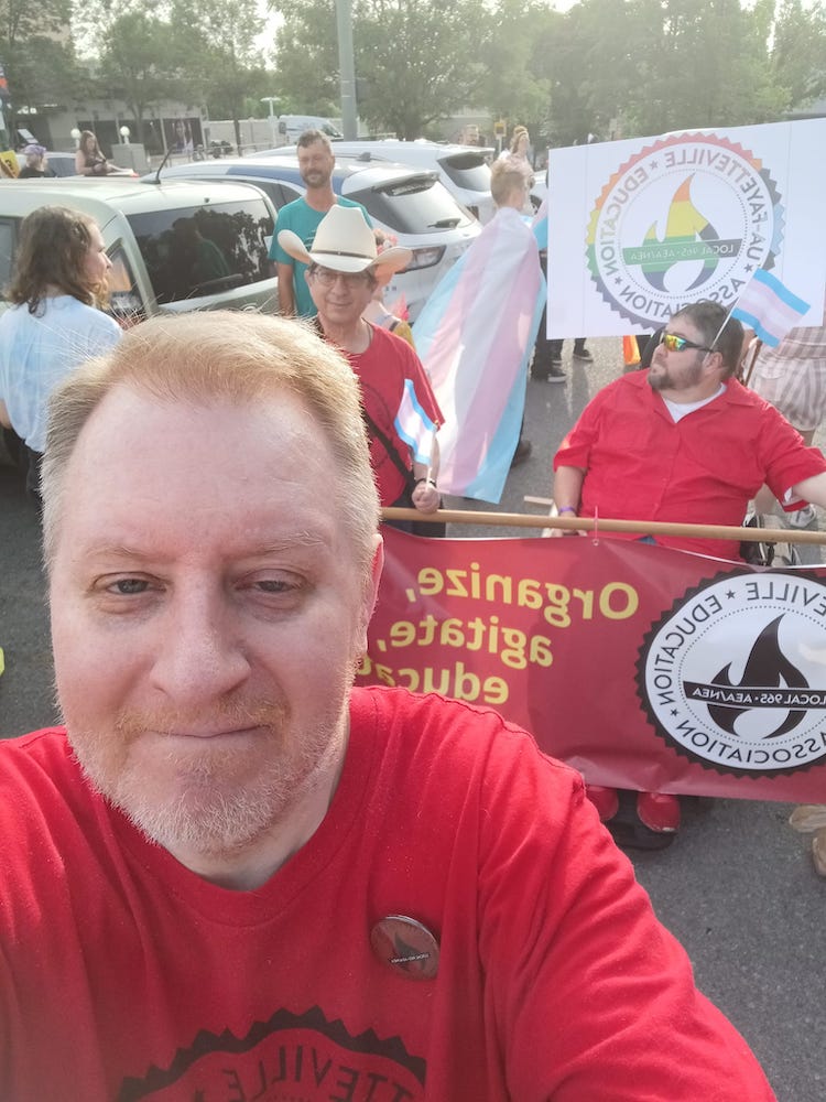 Former Local 965 board member Chad Kieffer frames a selfie with Vice President Ben Pollock and Local 965 President Hershel Hartford as they set up for the June 23, 2025 NWA Trans March.