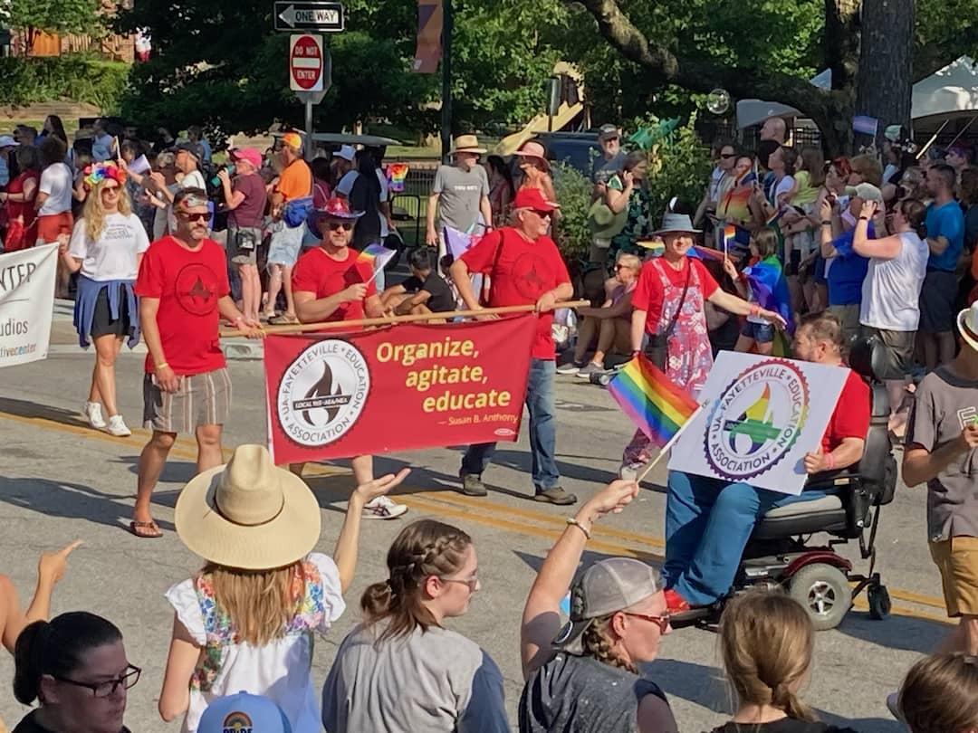 Local 965 President Hershel Hartford appears to address his troops Matt Stanley, Bret Schulte, Ted Swedenburg and Ben Pollock as they flow into the 19th annual NWA Pride Parade June 24, 2023.