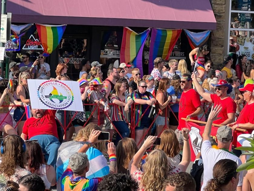 Local 965 President Hershel Hartford shouts as he twirls his wheelchair at the 19th annual Pride Parade June 24, 2023, joined by Treasurer Matt Stanley, Past President Bret Schulte and former board member Ted Swedenburg.