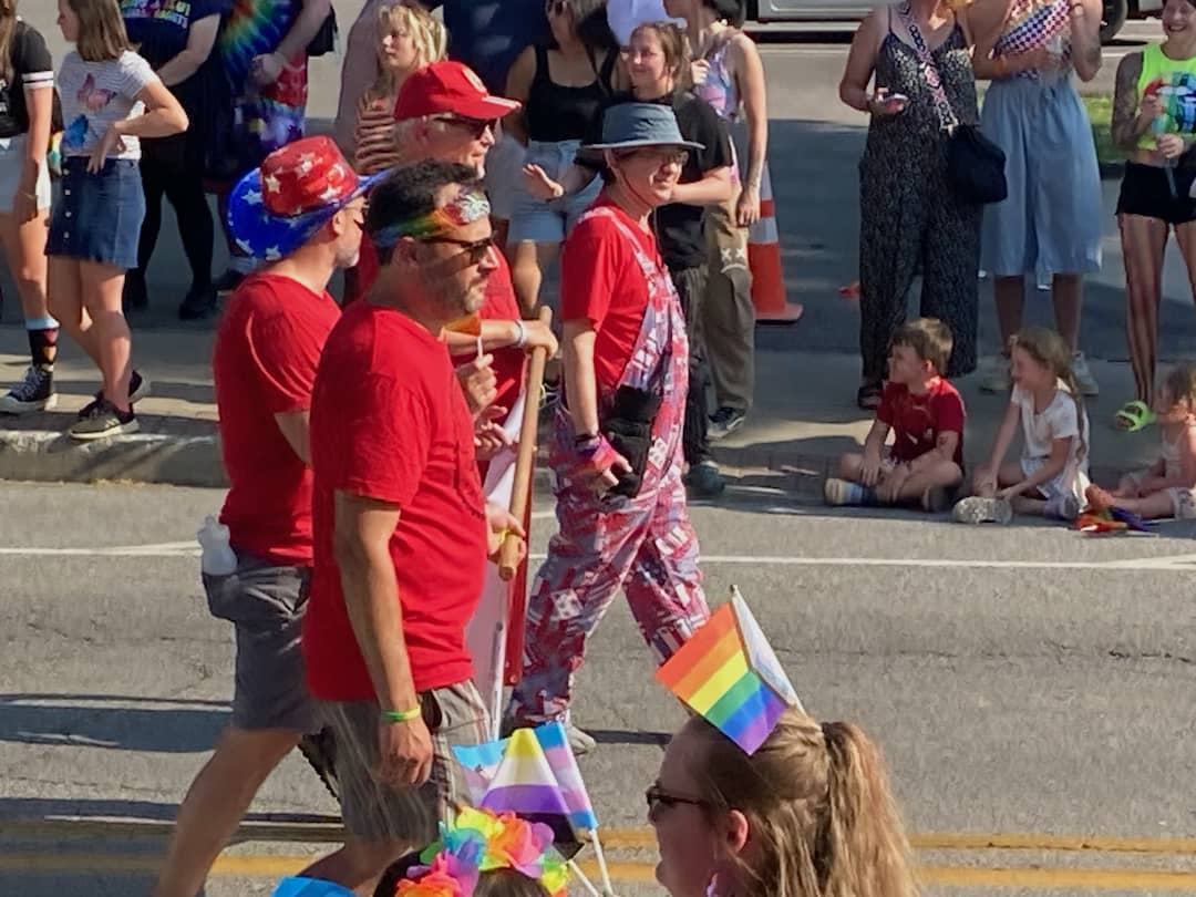 University of Arkansas workers Matt Stanley, Bret Schulte, Ted Swedenburg and Ben Pollock represent their Local 965 June 24, 2023, in the 19th annual NWA Pride Parade.