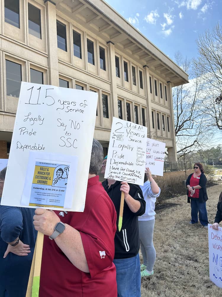 President April Reisma of the Arkansas Education Association watches the last speeches of the rally and march.