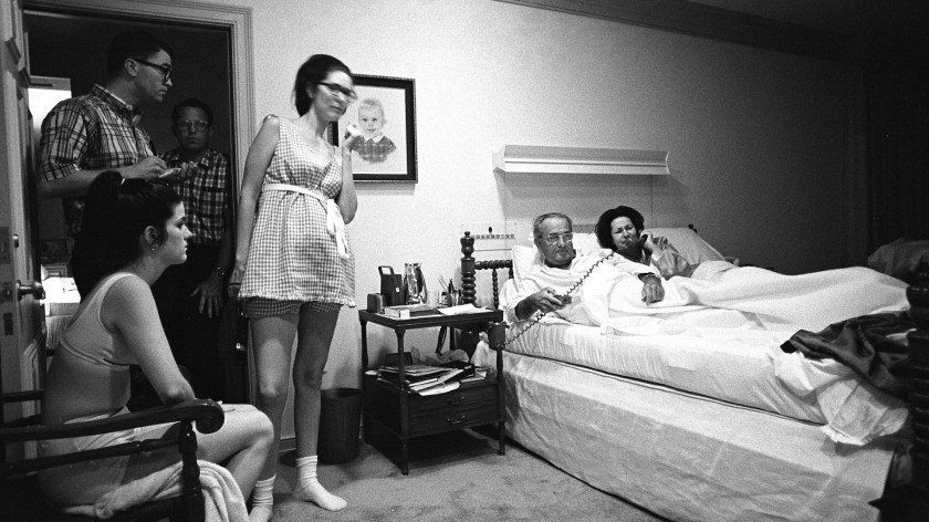 On Aug. 28, 1968, President Lyndon B. Johnson is watching TV coverage from Chicago of the Democratic National Convention from his bedroom at the LBJ Ranch in Texas with Luci Johnson Nugent, Tom Johnson, unidentified, Lynda Johnson Robb, President Johnson, Lady Bird Johnson.