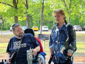 Local 965 President Hershel Hartford listens to state Rep. Denise Firmin Garner at the union's 2025 May Day picnic.