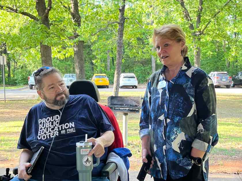Local 965 President Hershel Hartford listens to state Rep. Denise Firmin Garner at the union's 2025 May Day picnic.