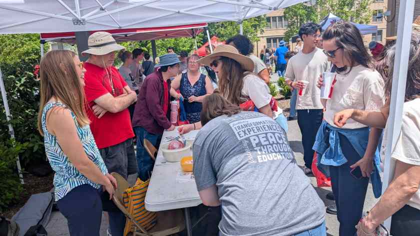 Local 965 board members Rachel Piontak and Michael Pierce and 965 Vice President Ben Pollock take questions from University of Arkansas staff workers May 14 at the 2025 Staff Appreciation Picnic on the Fayetteville campus.
