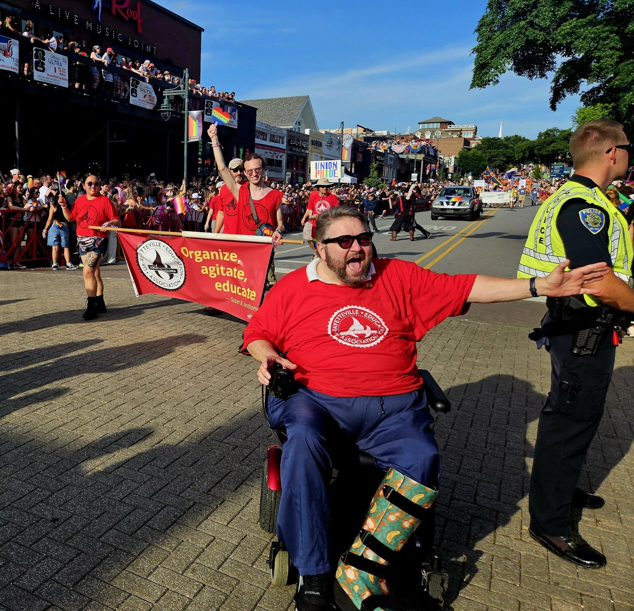 Hershel Hartford, president of UA-Fayetteville Education Association / Local 965, leads union members in the 2026 Northwest Arkansas Pride Parade in Fayetteville on June 27. Photo by Denise Garner.